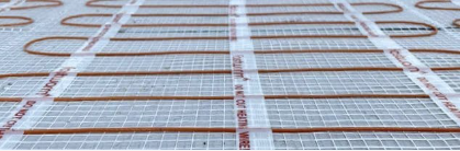 Electric underfloor heating cables close-up